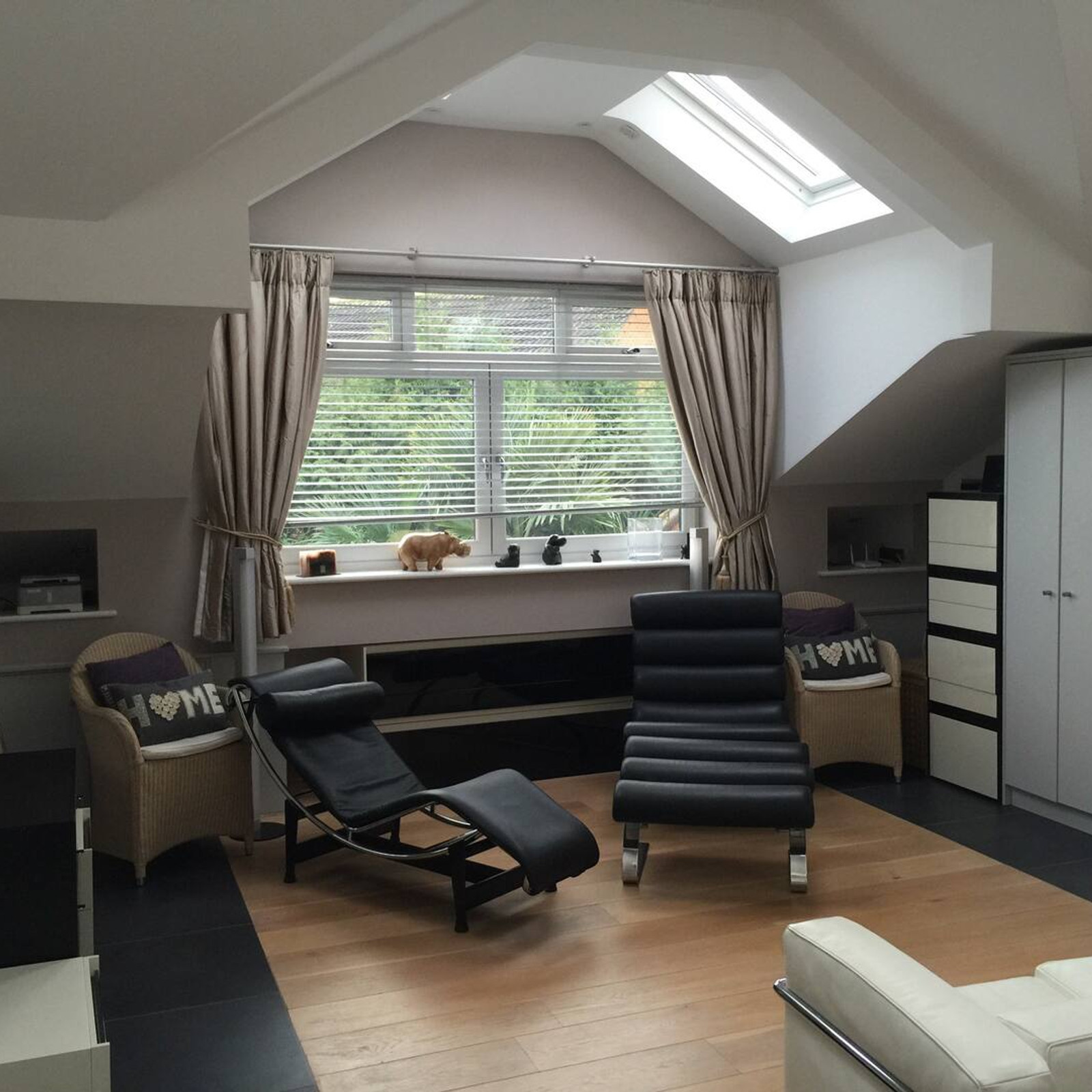 Bright open-plan living area with contemporary sofas