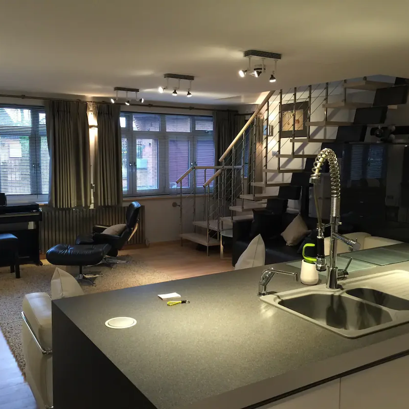 Spacious lounge with feature lighting